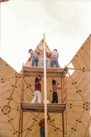 1 of 90 triangles (about 10' on a side) lifted up scaffolding & being put in place